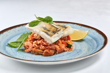 white fish with rice and vegetables