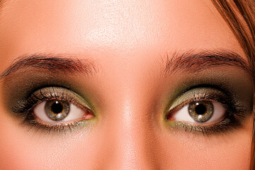 Naklejka premium Macro Green Girl Eyes with Green Eyeshadow