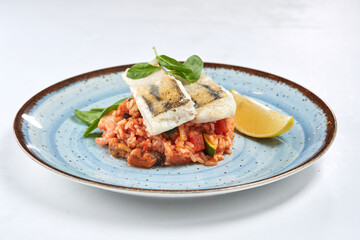 white fish with rice and vegetables