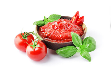 Tomato sauce in a bowl, Scented spice basil, Fresh ripe tomatoes, Chilli. Ingredient for the dish. Bowl full of tomato sauce with hot chili pepper, Spices and tomatoes isolated on white background.