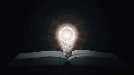 Glowing lightbulbs on the Book, Creative idea management, innovation, knowledge technology, and...