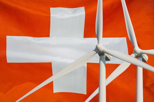 Two Wind Turbines for alternative energy on Switzerland flag background. Energy development and energy crisis. Eco power and Wind stations for renewable electric energy production in Switzerland - Powered by Adobe