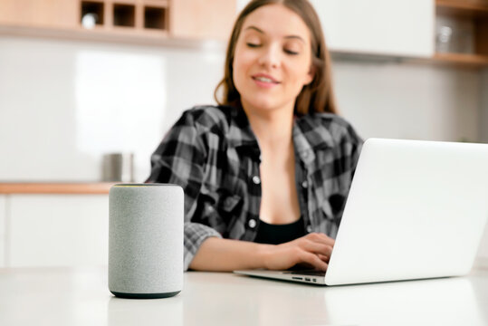 Woman using smart speaker