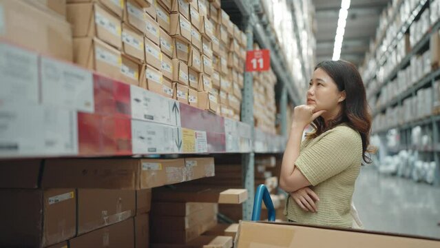 Asian women are shopping for product in a furniture warehouse