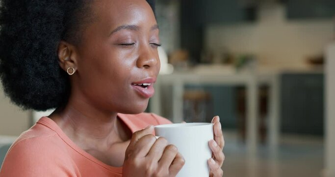 Relax, coffee or tea drink with girl on break to enjoy warm and delicious beverage alone in home. Black woman amazed, relieved and impressed with strong aroma taste in drinking mug for chill time.