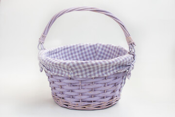 Fototapeta na wymiar empty wicker basket made of vines on a white background. Easter Item