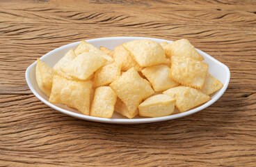 Pastel, typical brazilian finger food over wooden table
