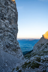 Sunrise on the top of the mountain with a view over the valley