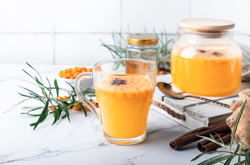 Homemade sea buckthorn tea with honey, ginger and spices