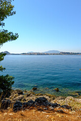 Obraz premium photographs of Corfu and the island of Vedos taken from a boat during a sightseeing trip