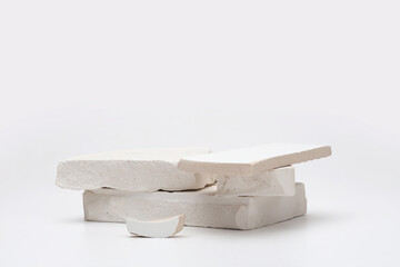 Stack white stones platform podium on gray light copy spase background. Minimal empty display product presentation scene.