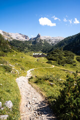 Fototapeta na wymiar Path leading hikers to a mountain hut in the Alps