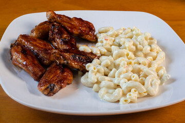 honey barbecue wings served with macaroni salad