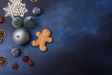 Christmas composition with gingerbread cookies, Christmas toys, pine cones and spices