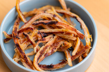 Dried squid snack in the plate