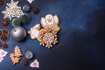 Christmas composition with gingerbread cookies, Christmas toys, pine cones and spices