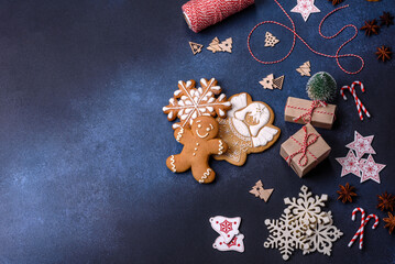 Christmas composition with gingerbread cookies, Christmas toys, pine cones and spices