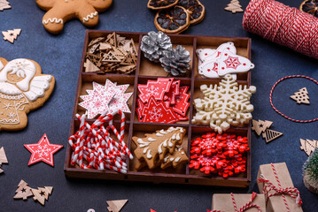 Christmas composition with gingerbread cookies, Christmas toys, pine cones and spices