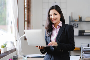 Asian business woman Business document check, account check, document search Legal documents, document preparation, reports, tax analysis, time, accounting, data sheets