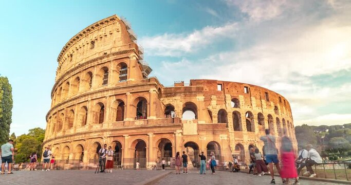 Stock 4k. Time lapse of the famous colosseum Rome, Italy at sunset. time lapse footage of people, life, Golden hour.
