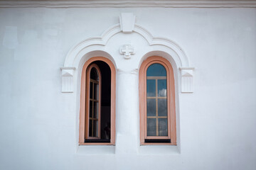 Arched windows of the building of the Church of the Holy Mother of God in the Belarusian village.