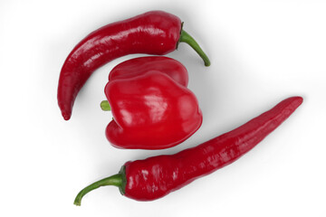 Two types of red pepper - bell pepper and chile pepper. Isolated on white background.