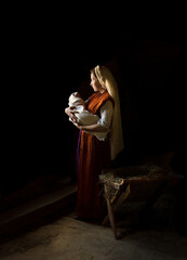 Mary in the stable near the manger with the baby
