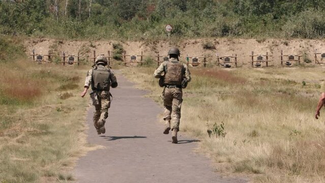 Soldiers runs to the gun target to observe the results of his or her shooting, to learn how to hit the target accurately and to practice military skills