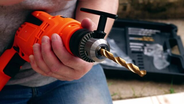 Fitting bit in electric power drill for diy 