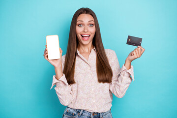 Naklejka premium Photo of hooray young woman show telephone card wear white shirt isolated on blue color background