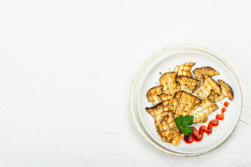 Fried slices Pleurotus eryngii mushrooms with sauce, spices and herbs. Healthy vegan food concept