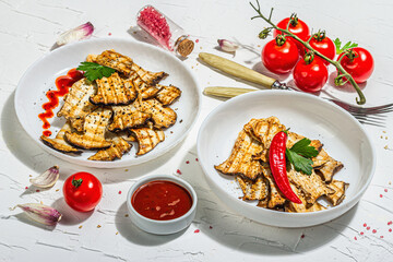 Fried slices Pleurotus eryngii mushrooms with sauce, spices and herbs. Healthy vegan food concept