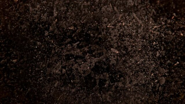 Super Slow Motion Shot of Exploding Soil Towards Camera at 1000fps.
