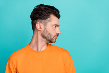 Side profile photo of young attractive handsome bearded serious look empty space new advert professional programmer isolated on aquamarine color background