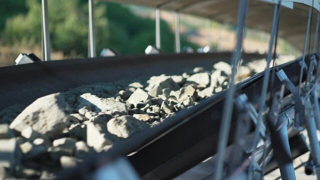 Conveyor belt moves ore from the quarry for processing, slow motion