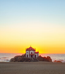 Fototapeta na wymiar Capela Senhor Pedra sunset ocean