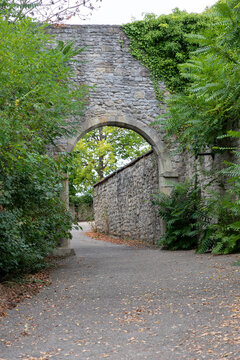 old, stone archway of a castle in autumn