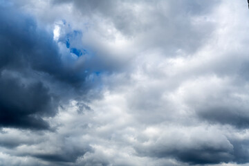 Cyclone in the sky. The movement of clouds in the blue sky. snow white clouds