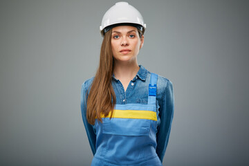 Serious woman architect or engineer in white safety helmet. Isolated female portrait.