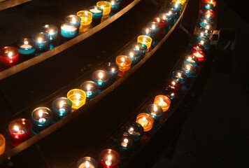 candles in the church for the prayers of the faithful