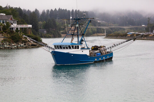 A fishing boat going out to sea in Brookings, Oregon