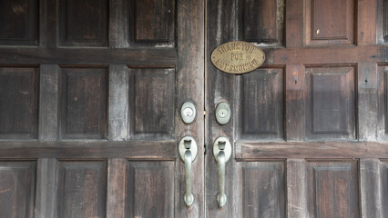 Thank you for not smoking on old wooden doors.