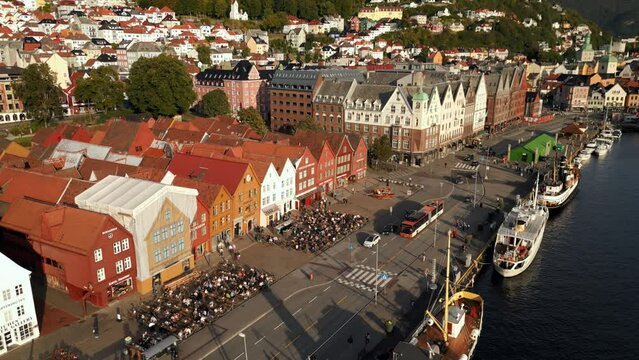 Tourists sitting outside at cafes in Bergen Norway