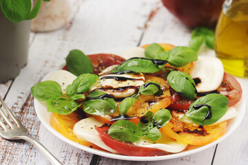 A plate with Italian salad caprese