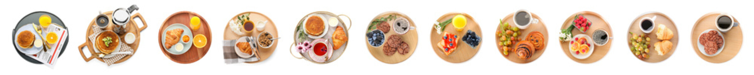 Set of trays with tasty breakfasts on white background, top view