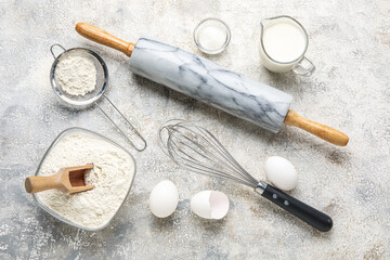 Fototapeta na wymiar Ingredients for baking on light background