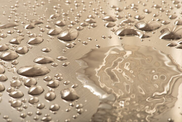 Macro water drops, macro photo of water drops on a reflective surface, selective focus.