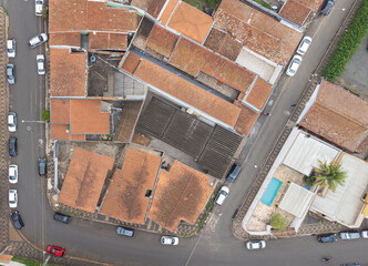 Houses, aerial drone photo part of a small town with bird's eye view, selective focus, natural light.