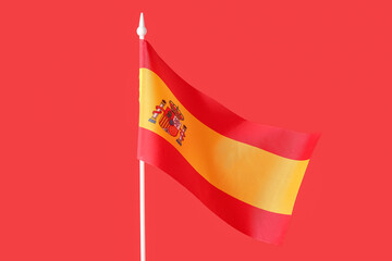 Naklejka premium National flag of Spain on red background