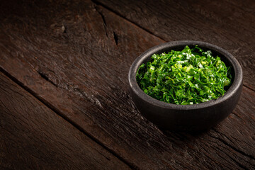 Bowl with chopped green cabbage sautéed in olive oil and garlic.